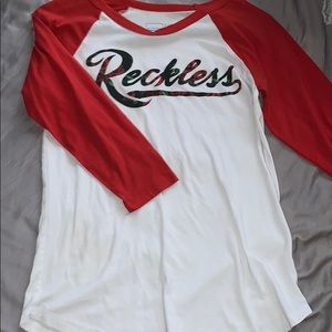 Women’s young and reckless baseball tee